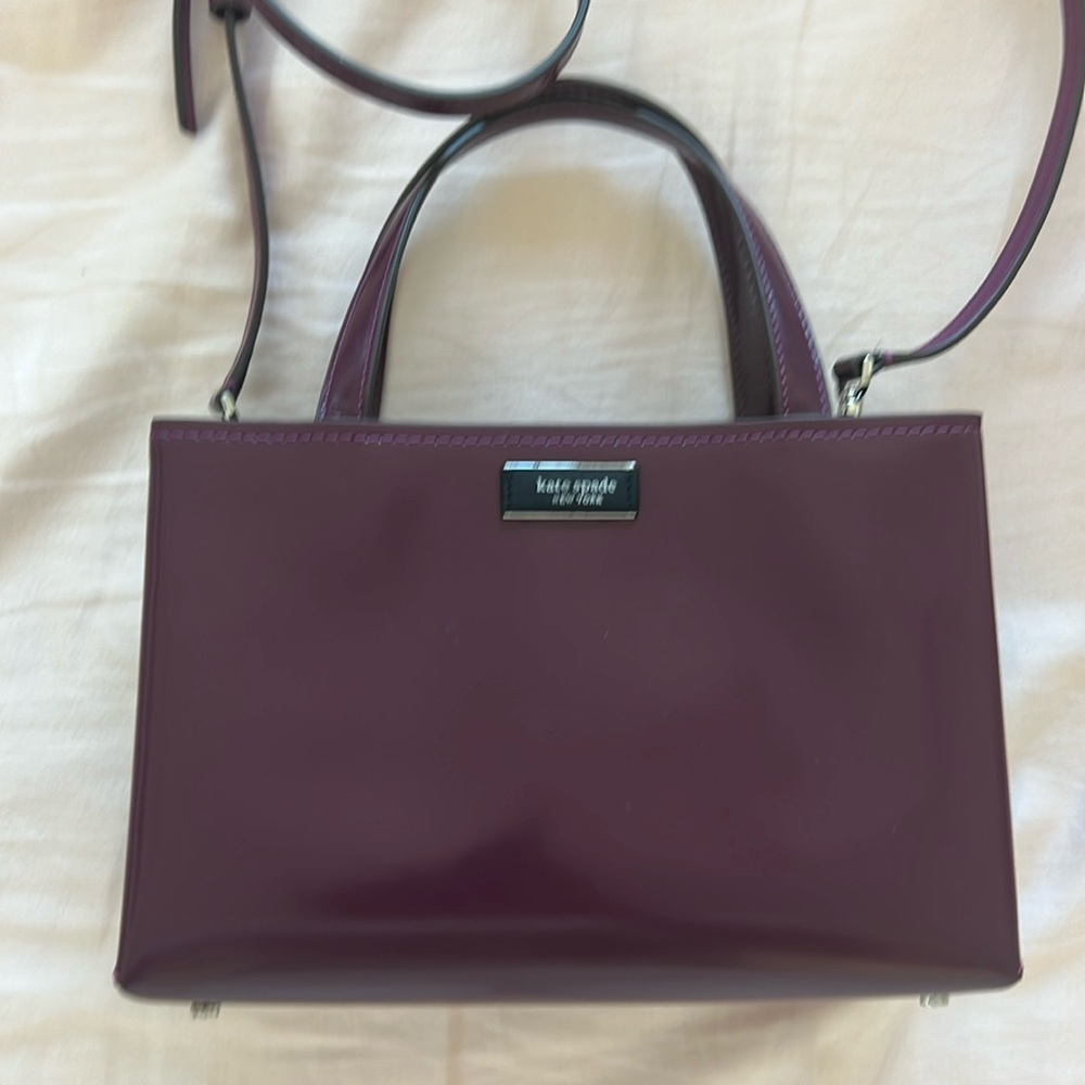 Kate spade top handle and cross body bag in burgundy color. Like new condition